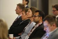 Row of people at a conference.